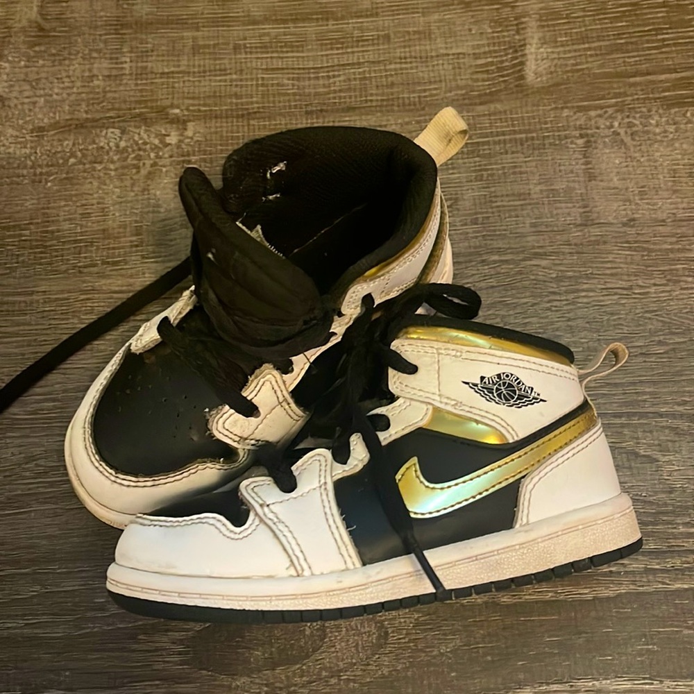 Jordan black gold and white air Jordan’s size 8 child